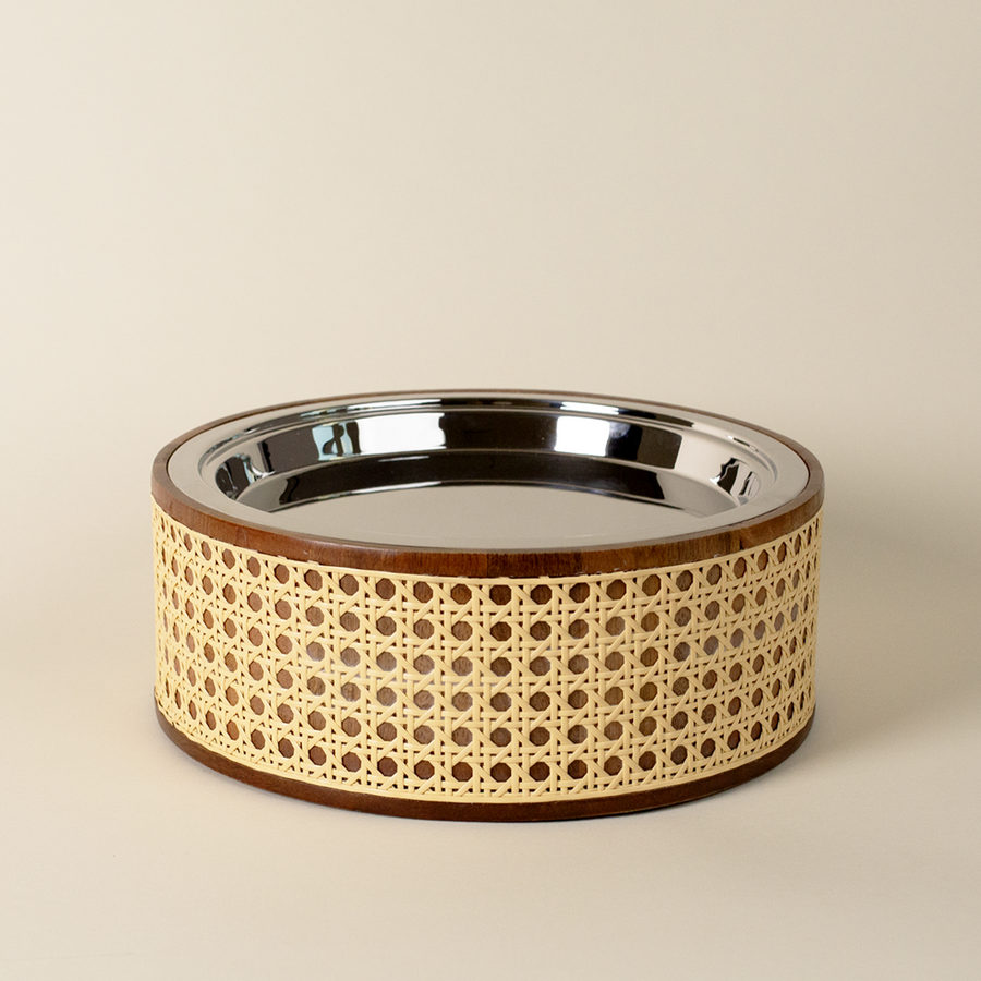 Dog bowl with decorative beige rim on a beige background